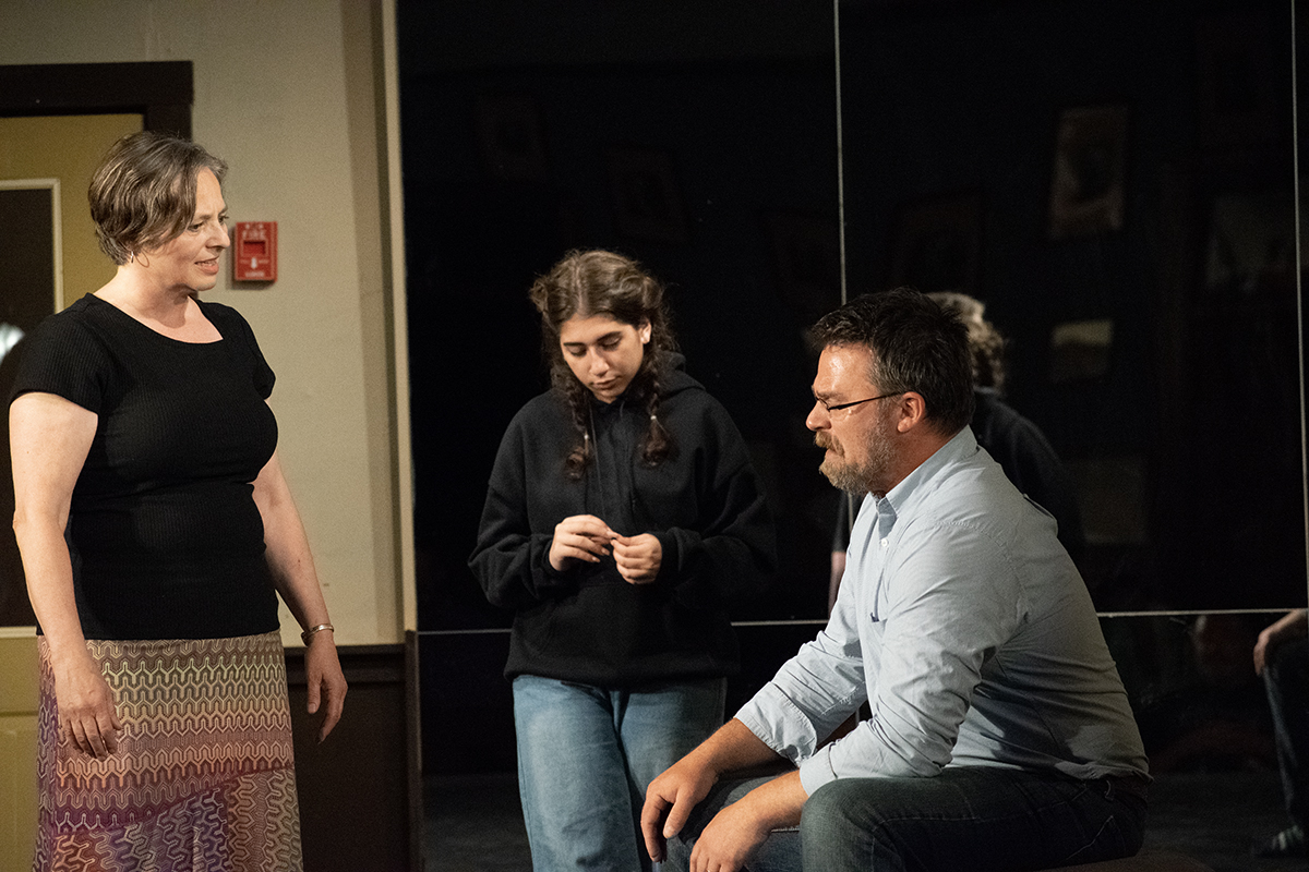 Class members do an improv exercise